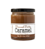 Short, lidded jar full of warm-colored caramel sauce, on white background. The jar is labeled “Paradigm Browned Butter Caramel Dessert Sauce – Net Weight 10oz (283g)”