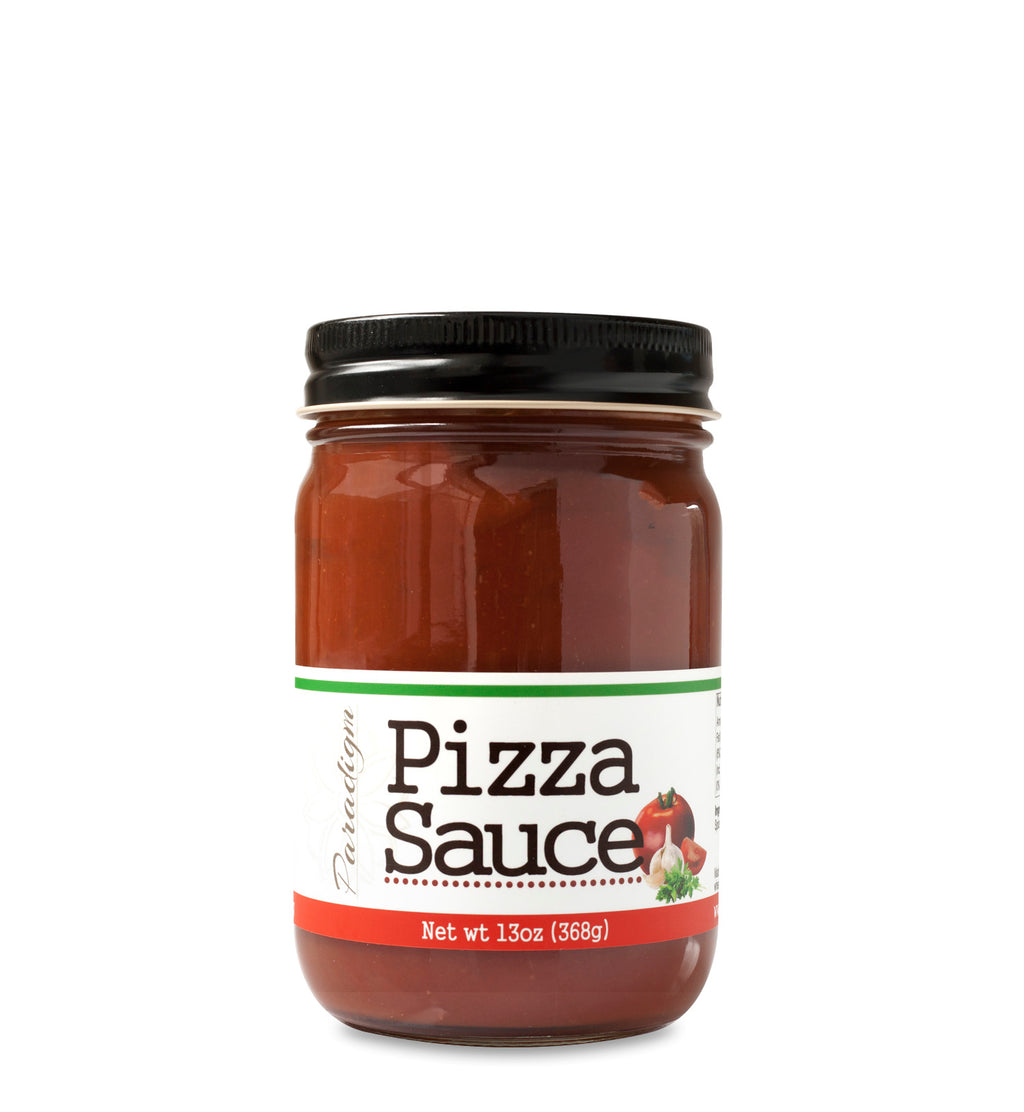 Lidded jar full of pizza sauce on white background. The jar is labeled, “Paradigm Pizza Sauce – Net Weight 13oz (368g)”.