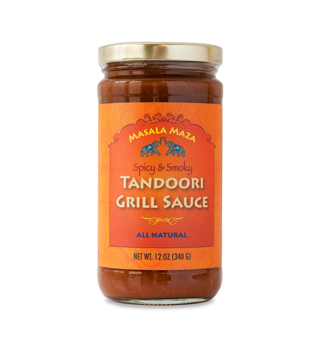 Gold-lidded jar of sauce on white background. The jar is covered in an orange label that says, “Masala Maza Spicy & Smoky Tandoori Grill Sauce – All Natural – Net Weight 12oz (340 G)”.