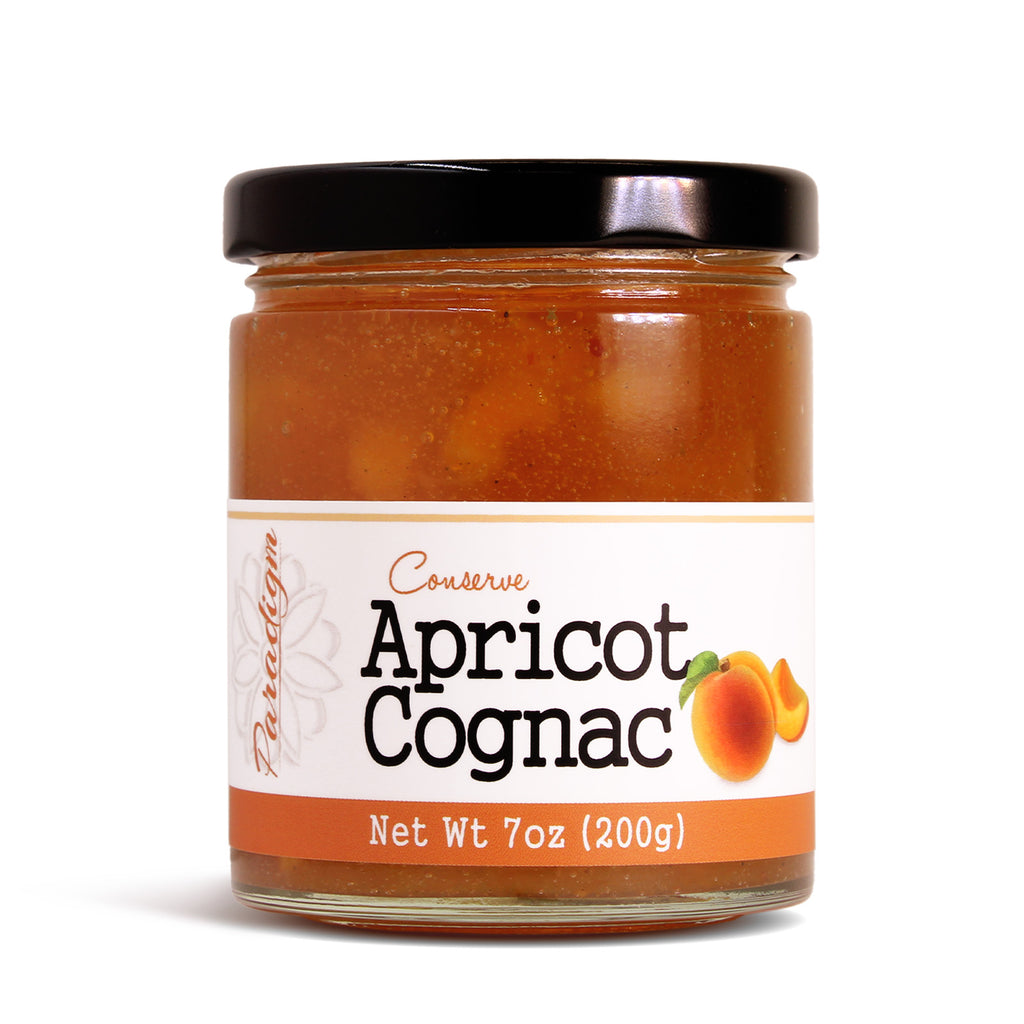 Jar of Paradigm Foodworks apricot cognac conserve with a white label on a white background