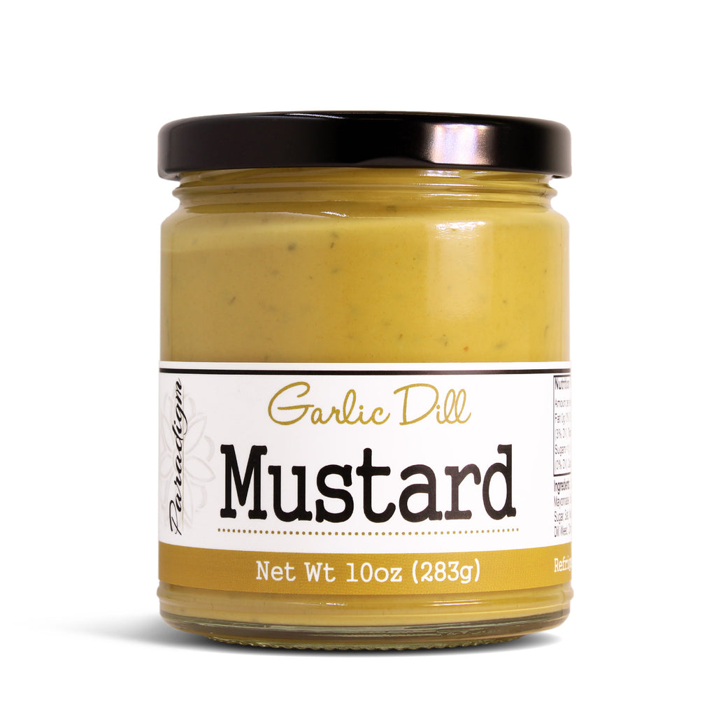 Jar of paradigm foodworks Garlic Dill Mustard with a white label on a white background