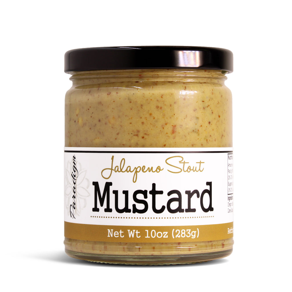 Jar of paradigm foodworks jalapeno stout mustard with a label on a white background