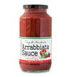 Tall, lidded jar full of Arrabbiata Sauce on white background. The jar is labeled, “Paradigm Sugo all’ Arrabbiata – Arrabbiata Sauce Traditional Spicy Marinara – Net Weight 25oz (708g)”.