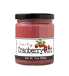 Short, lidded jar full of Cranberry Curd, on white background. The jar is labeled “Paradigm Sweet & Tangy Cranberry Curd– Net Weight 10oz (283g)” 