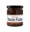 Short, lidded jar full of fudge sauce, on white background. The jar is labeled “Paradigm Deep Dark Haute Fudge Made with Madagascar Vanilla – Net Weight 10oz (283g)” 