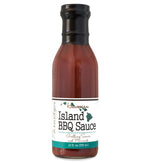 Glass ring neck bottle filled with barbecue sauce on white background. The bottle is labeled, “Paradigm Hawaiian Island BBQ Sauce – Grilling Sauce and Marinade – 12 fl oz (355ml)”