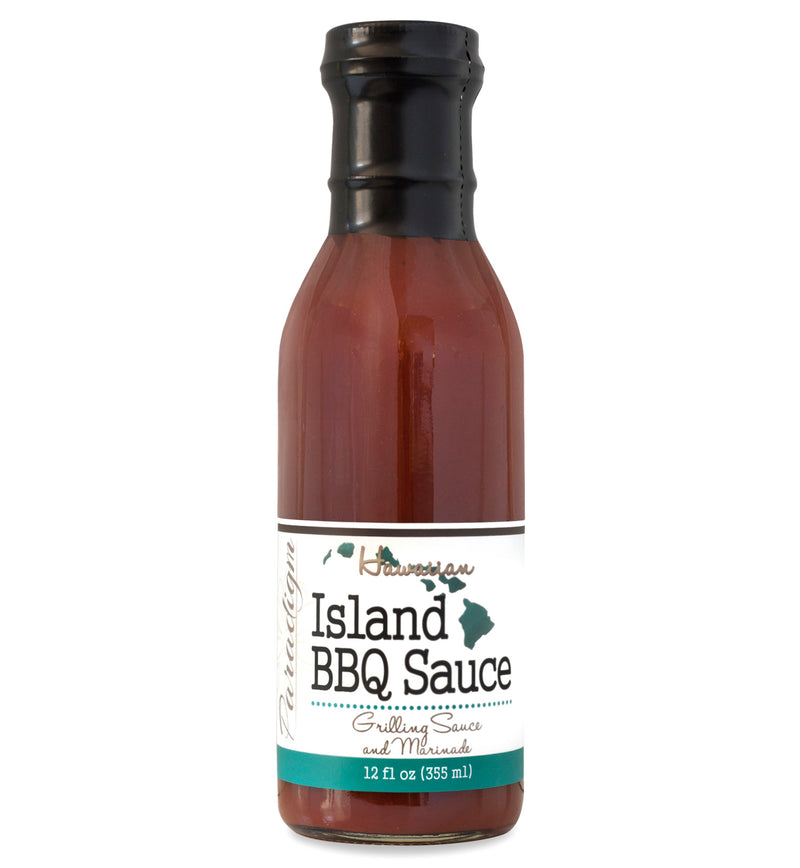 Glass ring neck bottle filled with barbecue sauce on white background. The bottle is labeled, “Paradigm Hawaiian Island BBQ Sauce – Grilling Sauce and Marinade – 12 fl oz (355ml)”