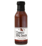 Glass ring neck bottle filled with barbecue sauce on white background. The bottle is labeled, “Paradigm Hawaiian Island BBQ Sauce – Grilling Sauce and Marinade – 12 fl oz (355ml)”