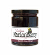 Short, lidded jar full of marionberry jam, on white background. The jar is labeled “Paradigm Seedless Marionberry Jam – Net Weight 11oz (311g)” 