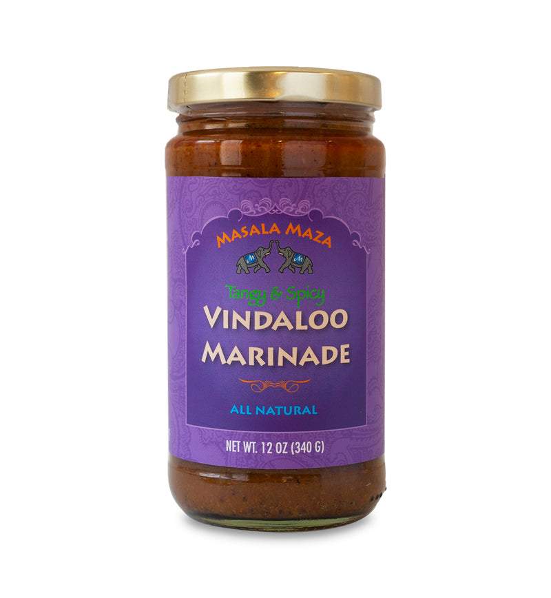 Gold-lidded jar of marinade on white background. The jar is covered in a purple label that says, “Masala Maza Tangy & Spicy Vindaloo Marinade – All Natural – Net Weight 12oz (340 G)”. 