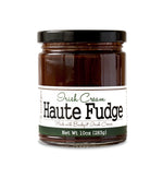 Short, lidded jar full of fudge sauce, on white background. The jar is labeled “Paradigm Irish Cream Haute Fudge Made with Bailey’s Irish Cream – Net Weight 10oz (283g)” 