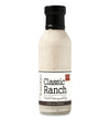 Glass ring neck bottle filled with ranch on white background. The bottle is labeled, “Paradigm Classic Ranch Salad Dressing and Dip – Net Weight 12 fl oz (355ml)” and “Made with non-GMO oil”. 